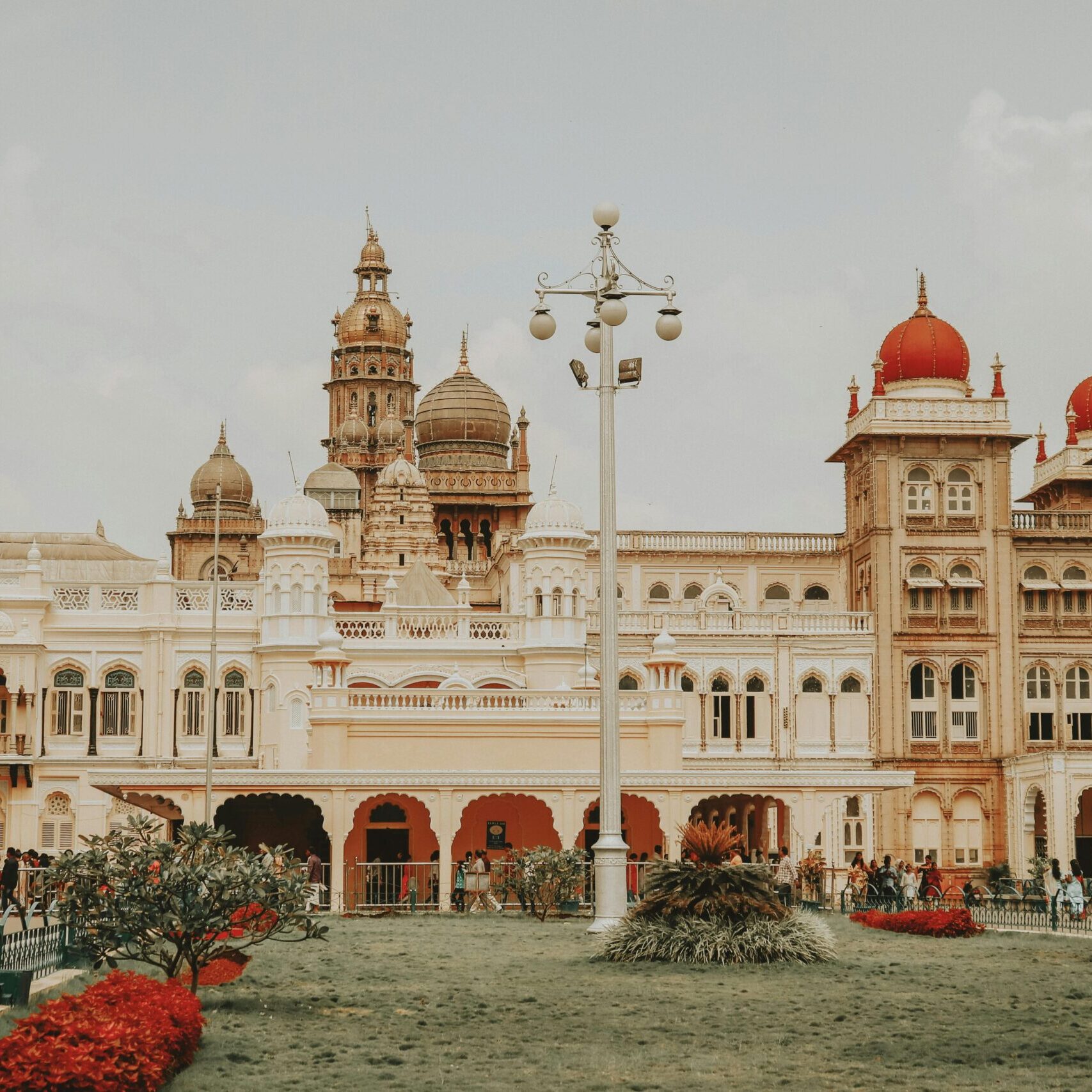 Mysore Palace's iconic architecture attracts tourists in Karnataka, India.